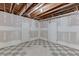 Unfinished basement with black and white checkered floors and white painted walls at 2623 Lindsey Grace Ln, Buford, GA 30519