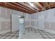 Unfinished basement with black and white checkered floors and white painted walls at 2623 Lindsey Grace Ln, Buford, GA 30519