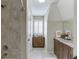 Cozy bathroom showcasing a walk-in shower and an elegant single vanity at 2623 Lindsey Grace Ln, Buford, GA 30519