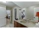 Bright bathroom with a vanity and shower area, with a view into another room at 2623 Lindsey Grace Ln, Buford, GA 30519