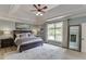 Spacious primary bedroom featuring large windows and soft, neutral decor at 2623 Lindsey Grace Ln, Buford, GA 30519