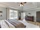 Bedroom featuring a dresser, large windows and plenty of natural light at 2623 Lindsey Grace Ln, Buford, GA 30519