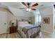 Comfortable bedroom features ceiling fan, wood floors, neutral paint and nice natural light at 2623 Lindsey Grace Ln, Buford, GA 30519