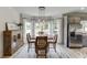 A bright dining area features lots of natural light, wood floors, and stainless steel appliances at 2623 Lindsey Grace Ln, Buford, GA 30519