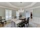 Dining area with chandelier, light walls and shuttered windows and wood floors, for a comfortable and inviting space at 2623 Lindsey Grace Ln, Buford, GA 30519