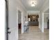 Inviting foyer with wood floors and decorative lighting offers a glimpse into the home's elegant living spaces at 2623 Lindsey Grace Ln, Buford, GA 30519