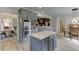 A spacious kitchen with gray cabinets, stainless appliances, and a center island at 2623 Lindsey Grace Ln, Buford, GA 30519