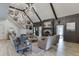 An elegant living room with high ceilings, a fireplace, and stylish furnishings at 2623 Lindsey Grace Ln, Buford, GA 30519