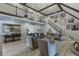 The living room features a soaring ceiling, chandelier, and second story balcony at 2623 Lindsey Grace Ln, Buford, GA 30519