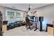 Basement room with a desk, multiple computer monitors, and a built-in shelving unit at 638 Oberlochen Way, Douglasville, GA 30134