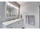 Bathroom featuring a large vanity with a marble countertop and a shower behind the door at 638 Oberlochen Way, Douglasville, GA 30134