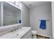 Updated bathroom featuring a large vanity, framed mirror and sliding glass door shower at 638 Oberlochen Way, Douglasville, GA 30134