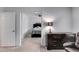 Hallway view into the bedroom featuring carpeted floors and neutral paint at 638 Oberlochen Way, Douglasville, GA 30134