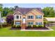 Charming two-story home with manicured lawn and ample parking at 638 Oberlochen Way, Douglasville, GA 30134