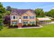 Charming two-story home with manicured lawn and ample parking at 638 Oberlochen Way, Douglasville, GA 30134
