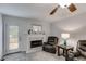 Comfortable living room with fireplace and seating at 638 Oberlochen Way, Douglasville, GA 30134