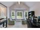 Bright office space with vaulted ceiling, built-in shelves, and plenty of natural light at 638 Oberlochen Way, Douglasville, GA 30134