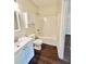Well-lit bathroom featuring white vanity and shower at 759 Hennepin Ter, Mcdonough, GA 30253