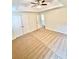 Spacious bedroom with neutral carpet, tray ceiling, and ceiling fan at 759 Hennepin Ter, Mcdonough, GA 30253