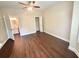 Spacious bedroom featuring modern wood floors and adjoining bath at 759 Hennepin Ter, Mcdonough, GA 30253