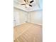 Spacious bedroom with neutral carpet, tray ceiling, and ceiling fan at 759 Hennepin Ter, Mcdonough, GA 30253