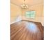 Dining room featuring stylish chandelier and classic wainscoting at 759 Hennepin Ter, Mcdonough, GA 30253