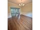 Open dining room with decorative lighting and wainscoting detail at 759 Hennepin Ter, Mcdonough, GA 30253