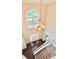 Bright foyer with hardwood floors, grand staircase, and chandelier at 759 Hennepin Ter, Mcdonough, GA 30253
