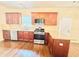 Bright kitchen with stainless steel appliances, granite counters, and wood floors at 759 Hennepin Ter, Mcdonough, GA 30253