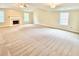 Spacious living room with carpeting, a fireplace, and large windows providing ample natural light at 759 Hennepin Ter, Mcdonough, GA 30253