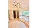 Luxurious bathroom with tile flooring, a jetted tub, shower, and a modern chandelier at 759 Hennepin Ter, Mcdonough, GA 30253