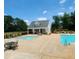 Community pool with ample seating and lounge areas at 759 Hennepin Ter, Mcdonough, GA 30253