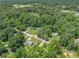Aerial view of the property with mature trees at 130 Driver St, Temple, GA 30179