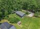 Aerial view showing the home, large yard, firepit, outbuildings and shed at 130 Driver St, Temple, GA 30179