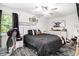 Comfortable bedroom with neutral decor, ceiling fan and carpet at 130 Driver St, Temple, GA 30179
