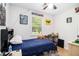 Cozy bedroom with a blue comforter, desk, and a window with natural light at 130 Driver St, Temple, GA 30179