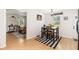 Dining area showcasing hardwood floors, a table for four, and a view of the living room at 130 Driver St, Temple, GA 30179