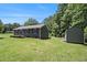 Quaint home with a storage shed in the backyard, perfect for additional storage and lawn maintenance at 130 Driver St, Temple, GA 30179