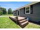 Welcoming front porch with wooden decking and steps, perfect for enjoying the outdoors at 130 Driver St, Temple, GA 30179