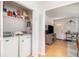 Convenient laundry area with washer, dryer, and shelving for storage at 130 Driver St, Temple, GA 30179