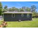 Home's backyard features a well-maintained lawn at 130 Driver St, Temple, GA 30179