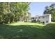 Large green grass back yard with deck and back view of home at 1349 Heather Cir, Riverdale, GA 30296