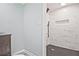 Bathroom featuring gray vanity with black fixtures and a tiled shower niche at 1349 Heather Cir, Riverdale, GA 30296
