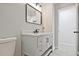 Bathroom featuring sleek gray vanity with black fixtures and a modern rectangular mirror at 1349 Heather Cir, Riverdale, GA 30296