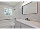 Beautifully remodeled bathroom featuring a marble-tiled shower and modern vanity with stylish fixtures at 1349 Heather Cir, Riverdale, GA 30296