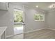 Kitchen space with access to the outdoor deck, gray walls, wood-look floors and natural light at 1349 Heather Cir, Riverdale, GA 30296