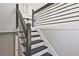 Stairway with black and white stairs, modern railings and white walls on the way to the second floor at 1349 Heather Cir, Riverdale, GA 30296