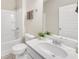 Bright bathroom features a shower-tub combo, tile floors, and a marble vanity with a chrome faucet at 1431 Beckett Dr, Hampton, GA 30228