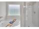 Modern bathroom featuring a soaking tub and separate shower with glass door at 1431 Beckett Dr, Hampton, GA 30228