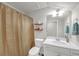 Bathroom featuring a shower/tub combo with a beige shower curtain and a marble vanity at 1431 Beckett Dr, Hampton, GA 30228